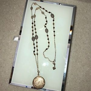 Long chain, beaded necklace with locket.
